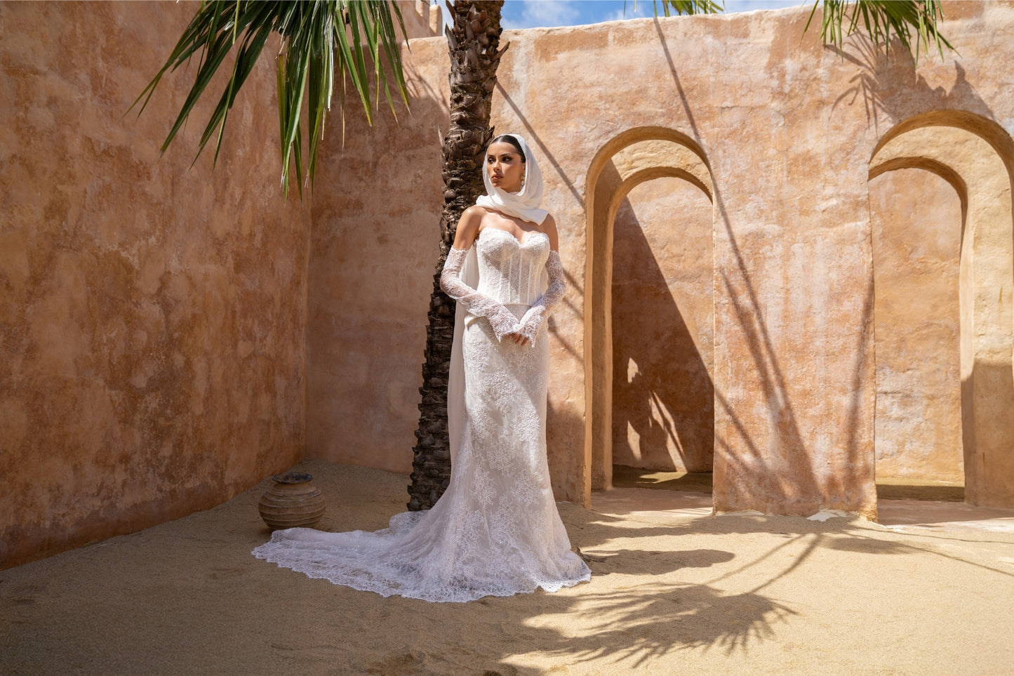 2-piece lace wedding gown, corset top and fitted skirt. paired with fitted sleeves