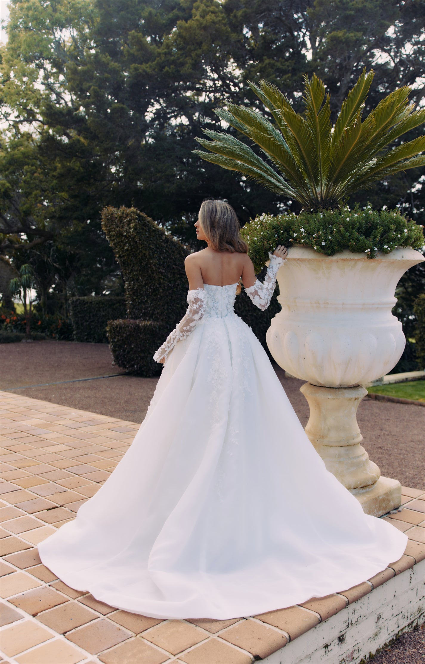 ARTEMIS Bridal gown - By Victoria Collection Jessica Couture, featuring an A-line Princess Ballgown covered in delicate leaf lace, Basque Waist and chapel train.