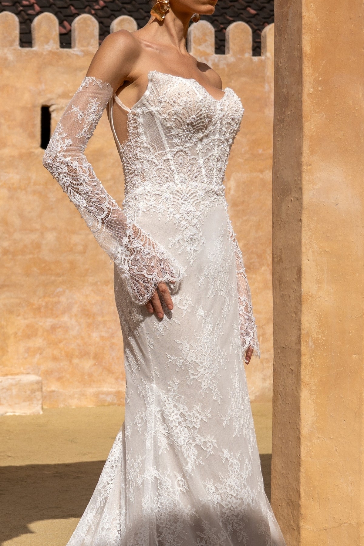 fitted lace wedding gown, with detachable fitted sleeves.
