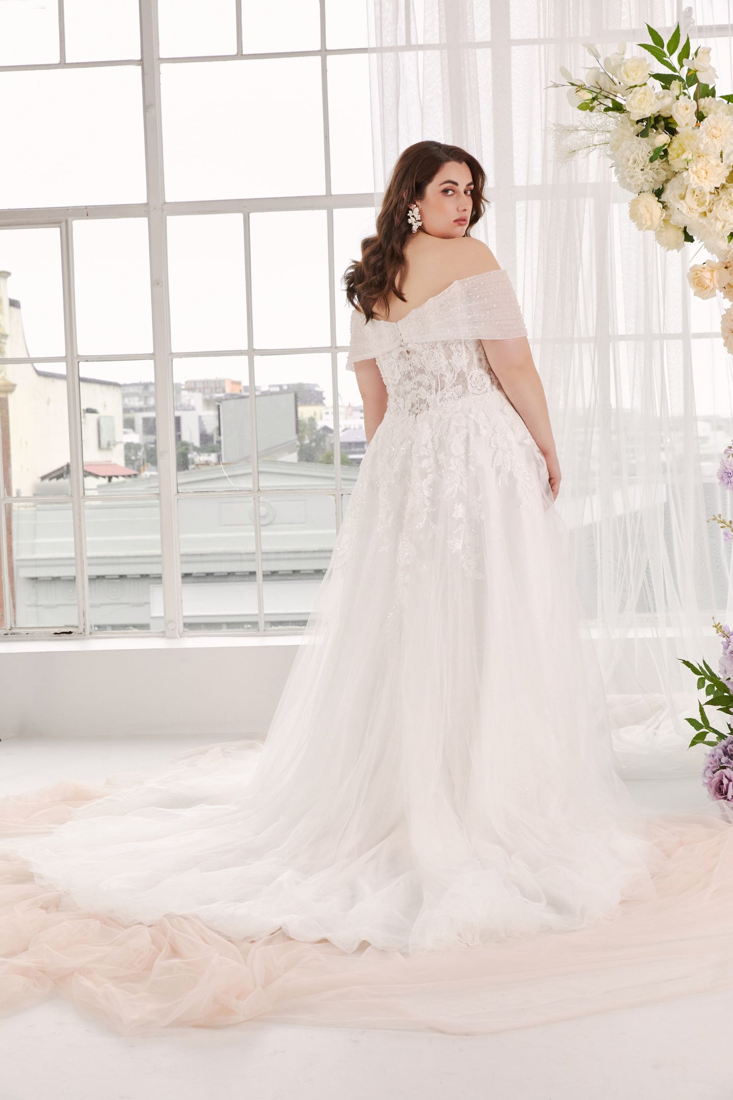 Off-the-shoulder V-neck A-line wedding dress.