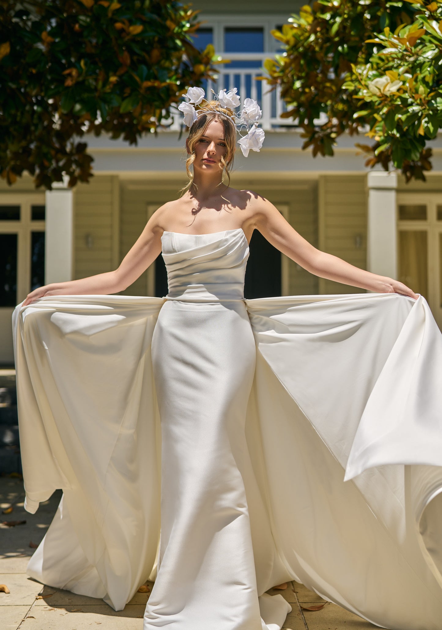 Closer view of voluminous Lisha overskirt in ivory mikado fabric