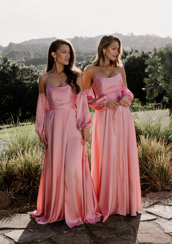 Violette bridesmaid gown in pink satin. Strapless bustier style with detachable sleeve and front split