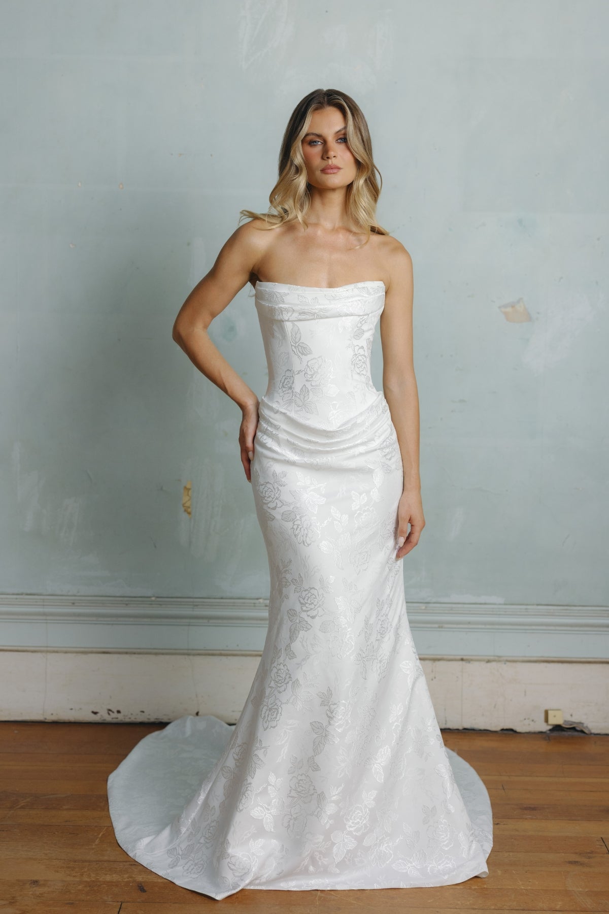 Fit n flare wedding gown in floral jacquard fabric, strapless neckline and ruching around bust and hips.