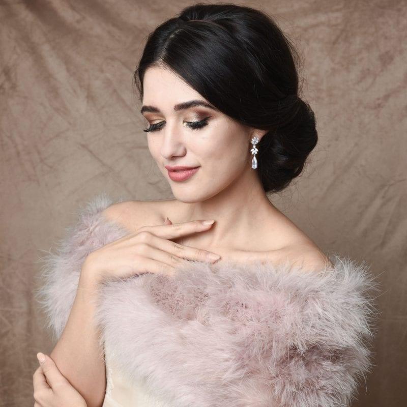 Clusters of marquise cut cubic zirconia with elongated pear cut gem dangling from the bottom. Set in rose gold.