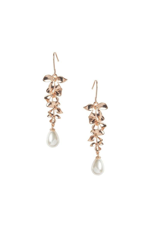 Dangling earring with orchid petals in gold and a teardrop pearl hanging from the bottom