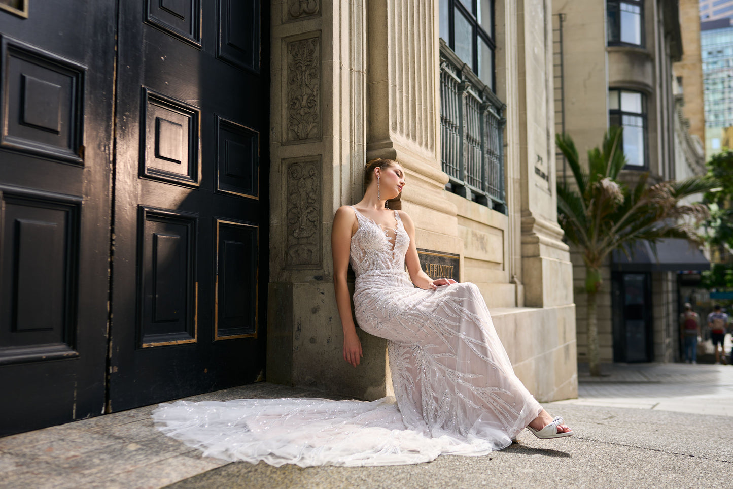 Fit-n-flare dress in feather-like beaded lace. Plunging v-necklines front and back.