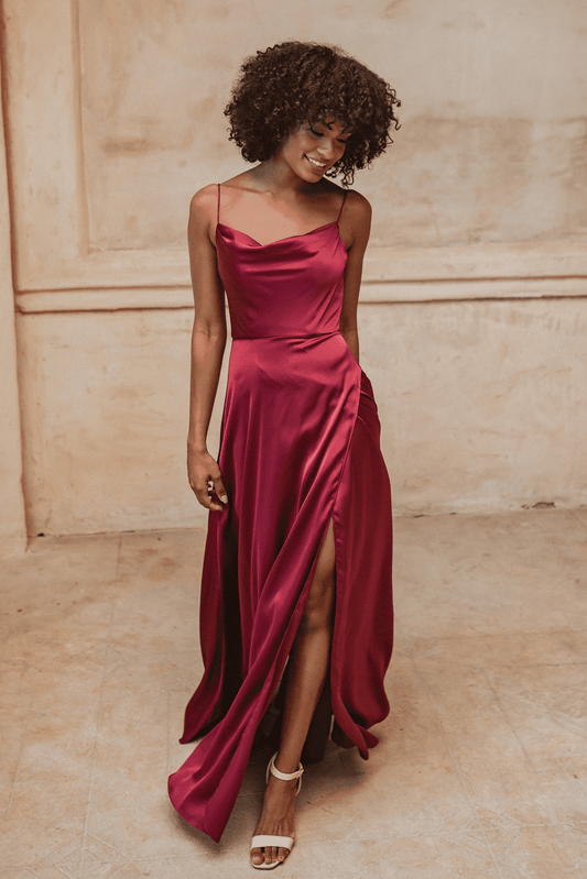 Denver bridesmaid gown in wine coloured satin. Cowl neck with shoestring straps and high leg split