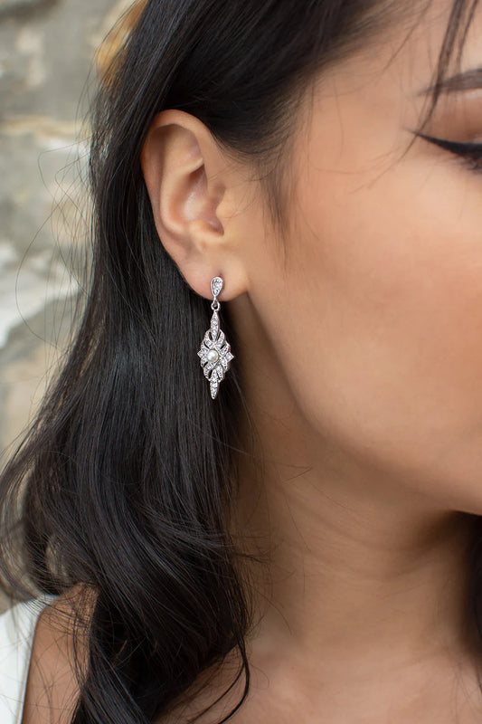 Antoinette vintage style earring with cubic zirconia and a small pearl at the centre of diamond shaped drop.