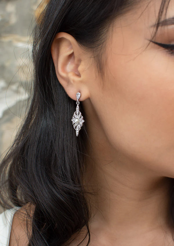 Antoinette vintage style earring with cubic zirconia and a small pearl at the centre of diamond shaped drop.