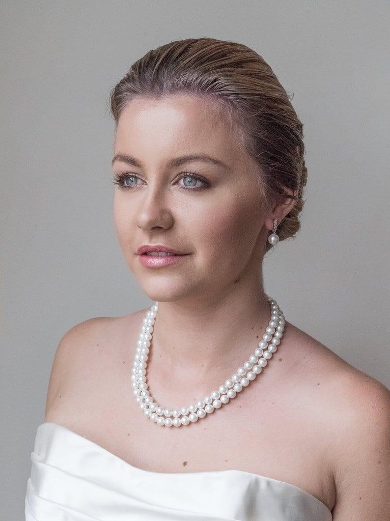 Zara earrings with small cubic zirconia with a cultured pearl drop. Set in silver