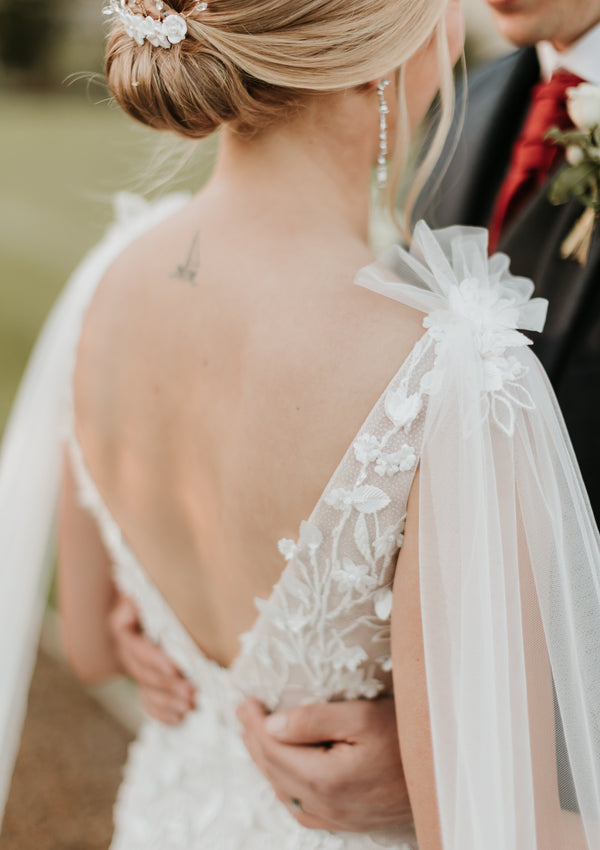Back view of bride wearing Saige gown with low V-backline and 3D lace