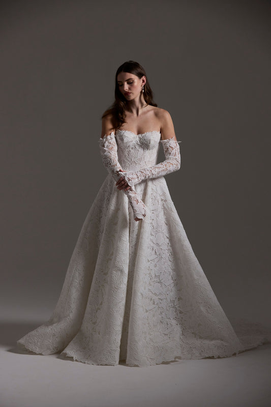 A-line Wedding dress in floral Jacquard fabric with fitted sleeves and a strapless bodice 