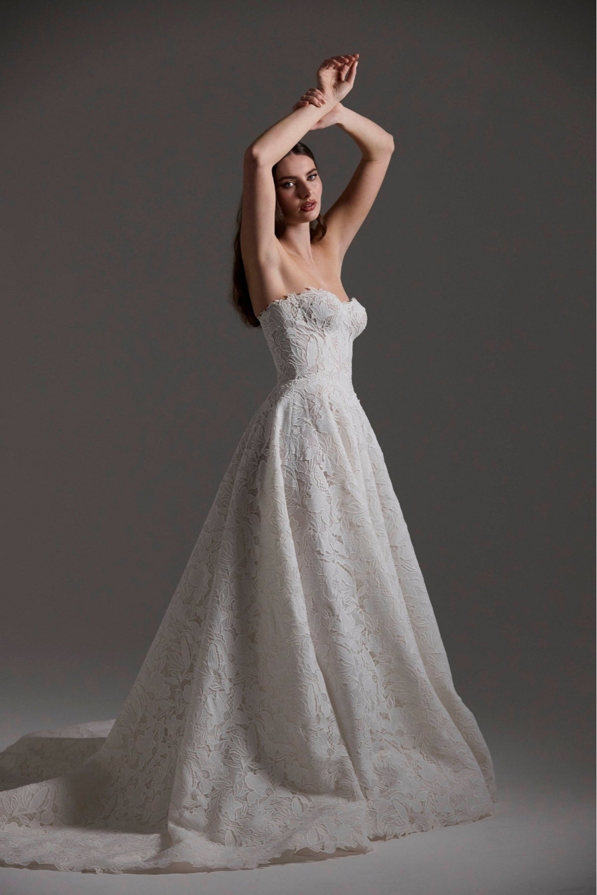 A-line Wedding dress in floral Jacquard fabric with fitted sleeves and a strapless bodice 