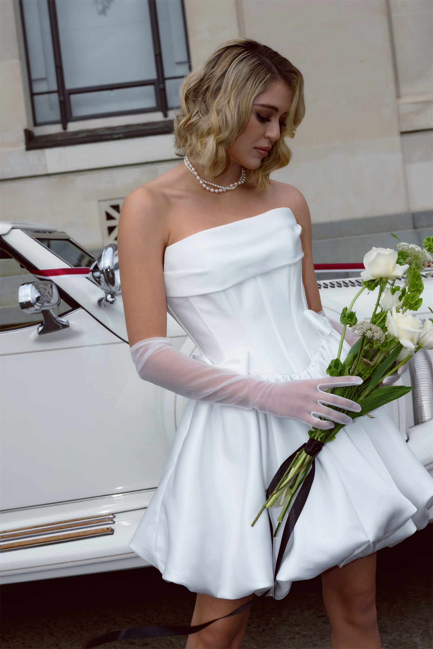 Mini wedding gown with bubble skirt and mini bows. Corseted Bodice with Ruched bust. 