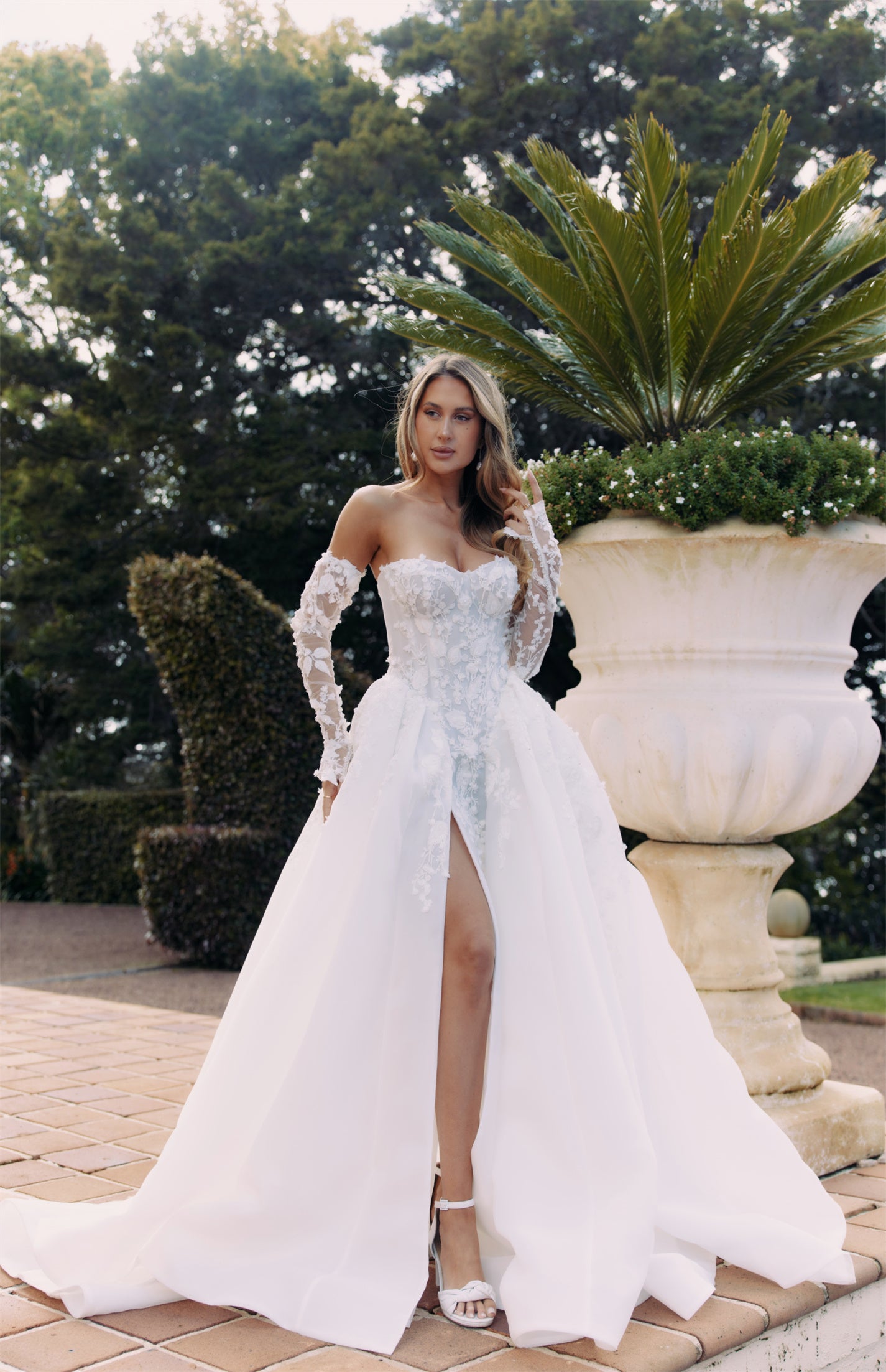 ARTEMIS Bridal gown - By Victoria Collection Jessica Couture, featuring an A-line Princess Ballgown covered in delicate leaf lace, Basque Waist and chapel train. 
