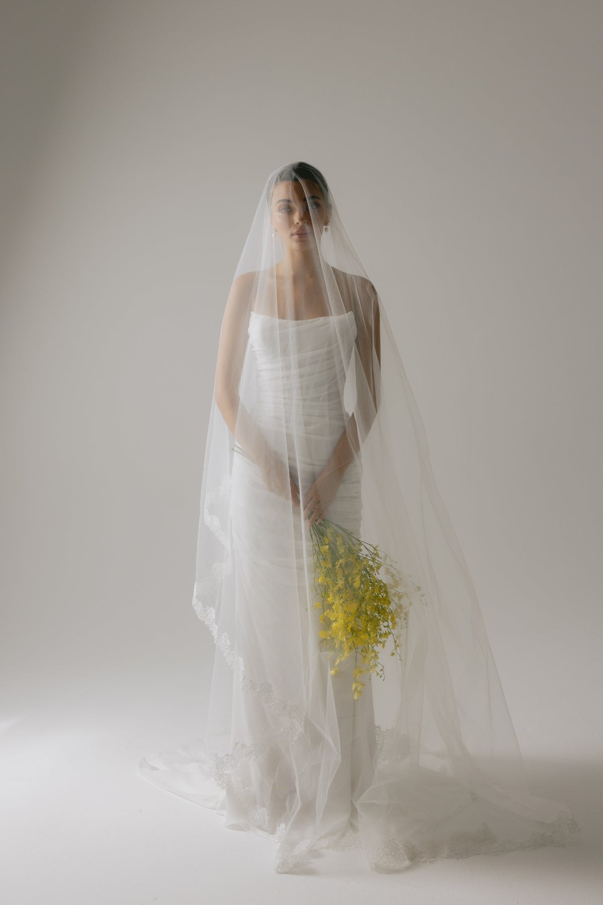 Corseted chiffon wedding gown, fitted lace-up back style. 