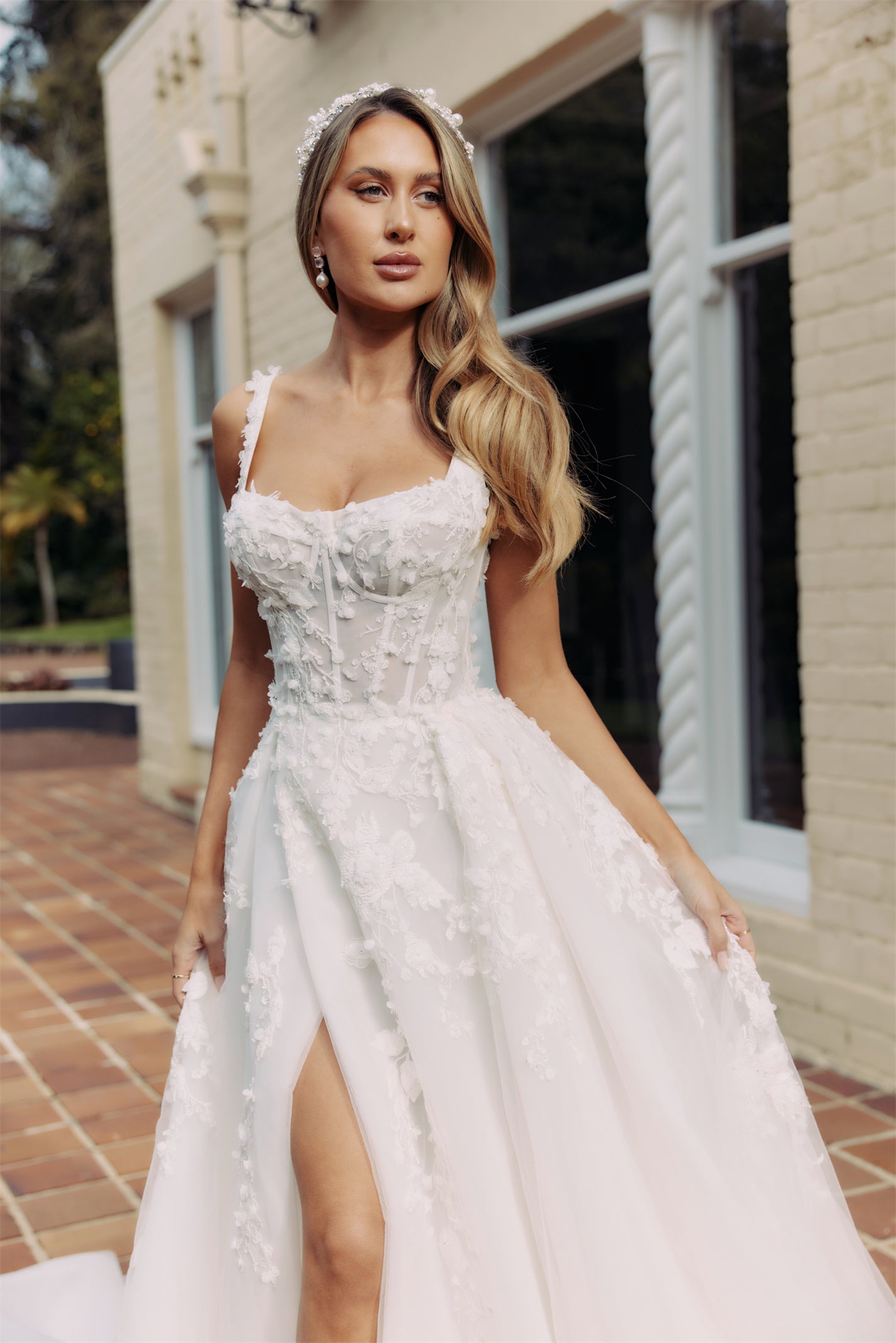 CALYPSO Bridal gown - By Victoria Collection Jessica Couture, featuring an A-line Princess Ballgown covered in delicate leaf lace, Squared neckline and chapel train. 