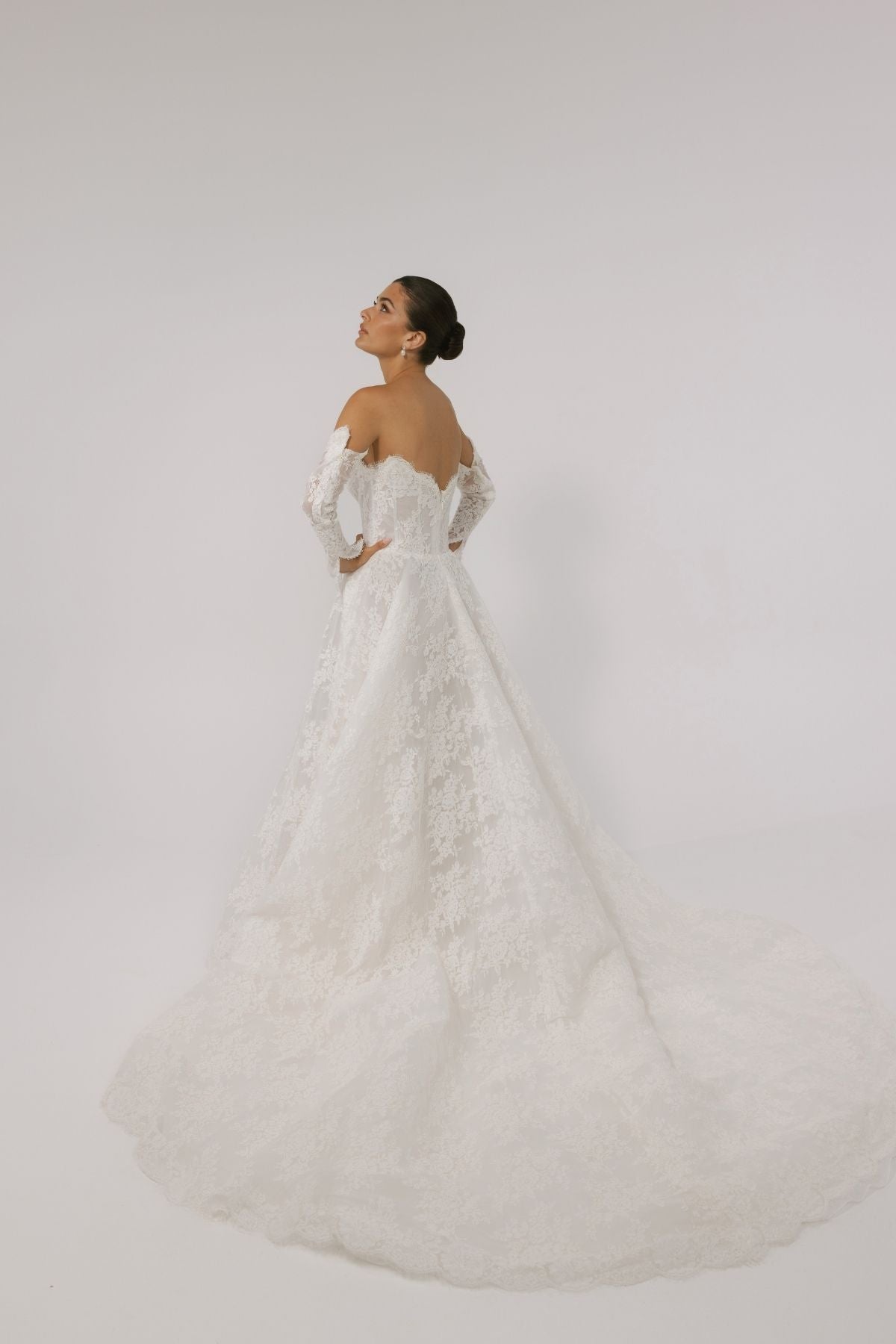 Lace A-line wedding gown with off the shoulder sleeves, dramatic chapel train 