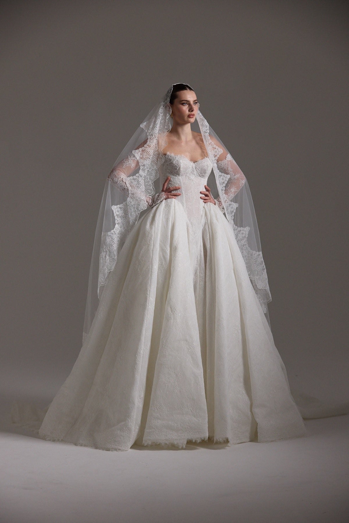 A line ballgown wedding dress with sweetheart neckline,  and deep basque waistline in chantilly lace 