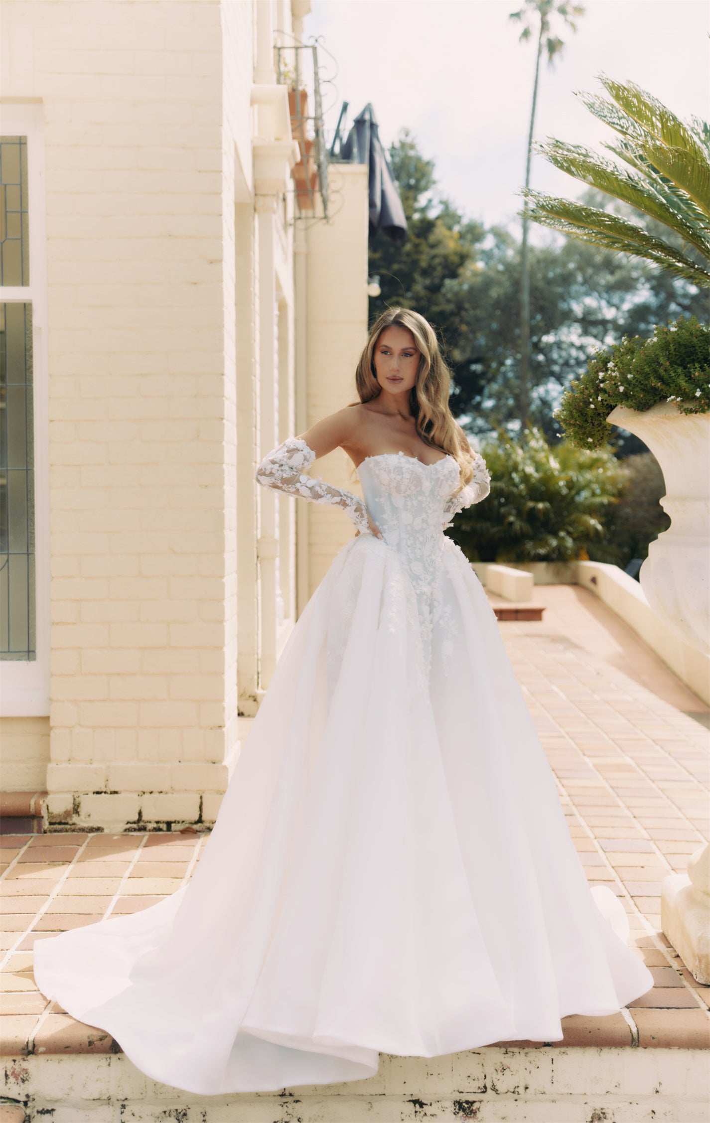ARTEMIS Bridal gown - By Victoria Collection Jessica Couture, featuring an A-line Princess Ballgown covered in delicate leaf lace, Basque Waist and chapel train. 