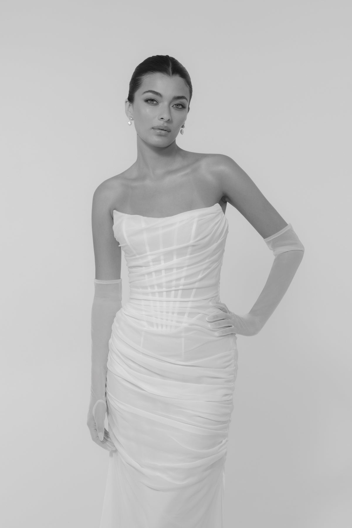 Corseted chiffon wedding gown, fitted lace-up back style. 