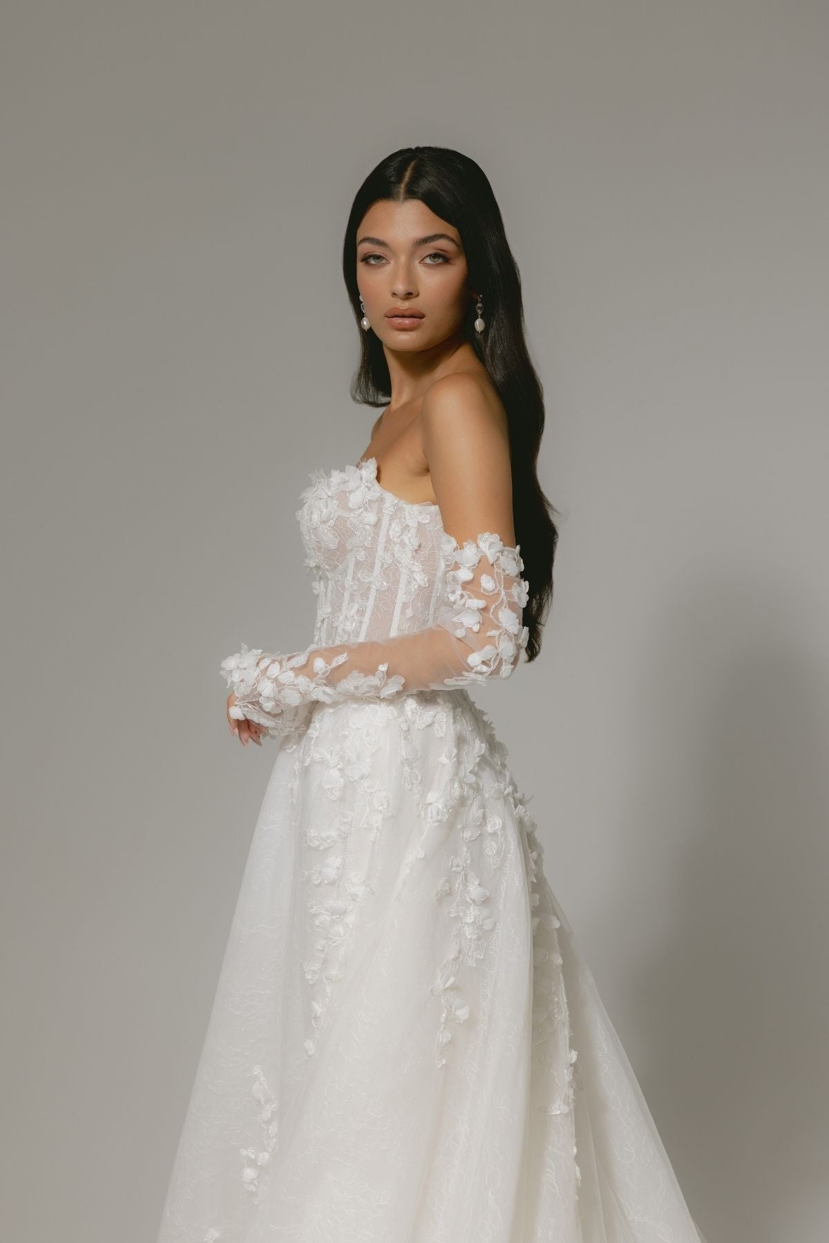 floral wedding gown with corseted bodice, A line skirt featuring split. paired with matching floral lace sleeves 