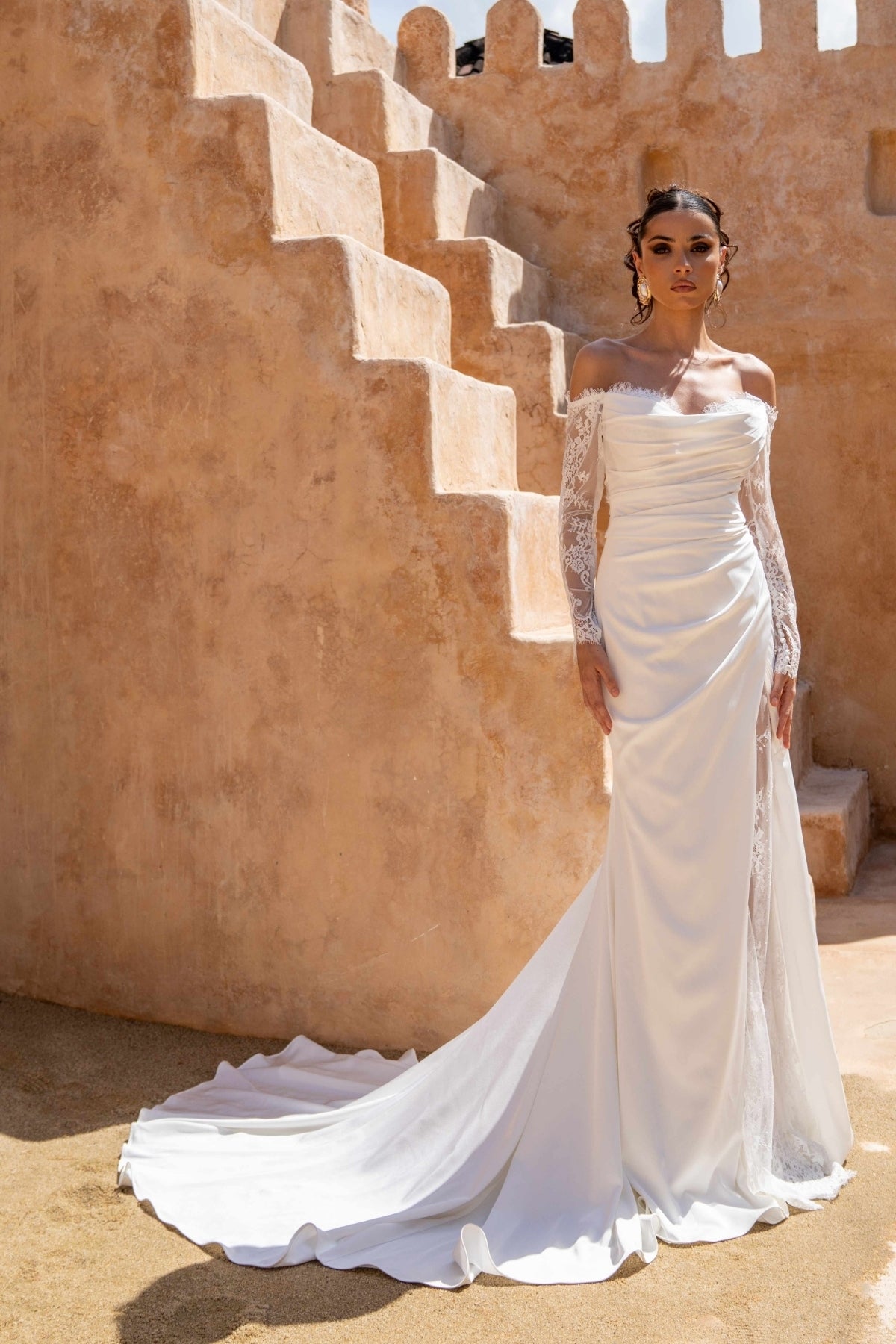 Fitted wedding dress, in plain crepe with lace covering the split. sweetheart neckline, complete with detachable fitted lace sleeves 