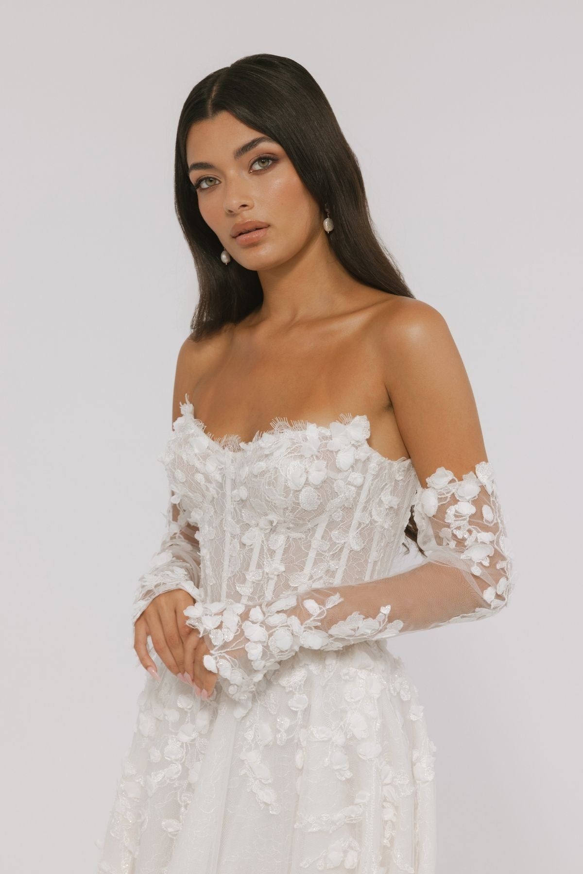 floral wedding gown with corseted bodice, A line skirt featuring split. paired with matching floral lace sleeves 