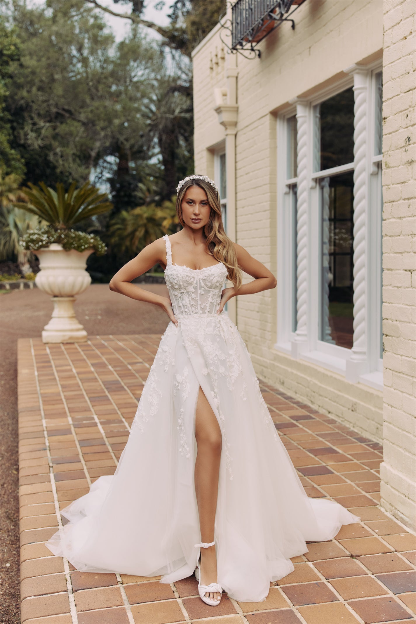 CALYPSO Bridal gown - By Victoria Collection Jessica Couture, featuring an A-line Princess Ballgown covered in delicate leaf lace, Squared neckline and chapel train. 