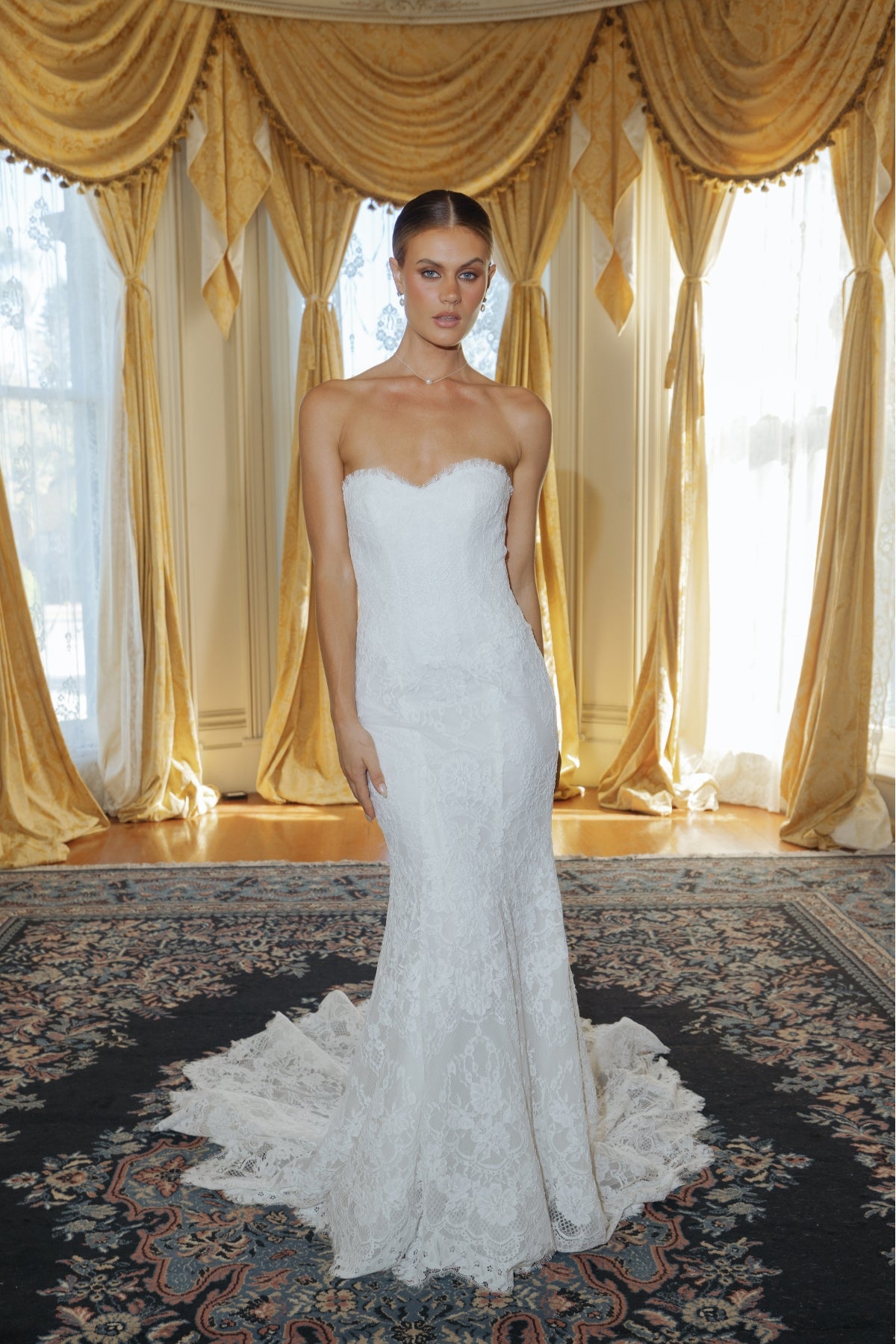 fitted lace wedding gown with sweetheart neckline and scalloped train 