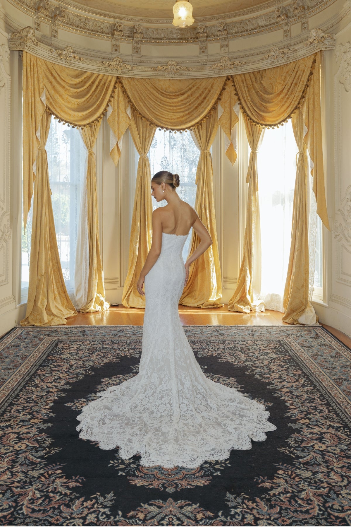 fitted lace wedding gown with sweetheart neckline and scalloped train 