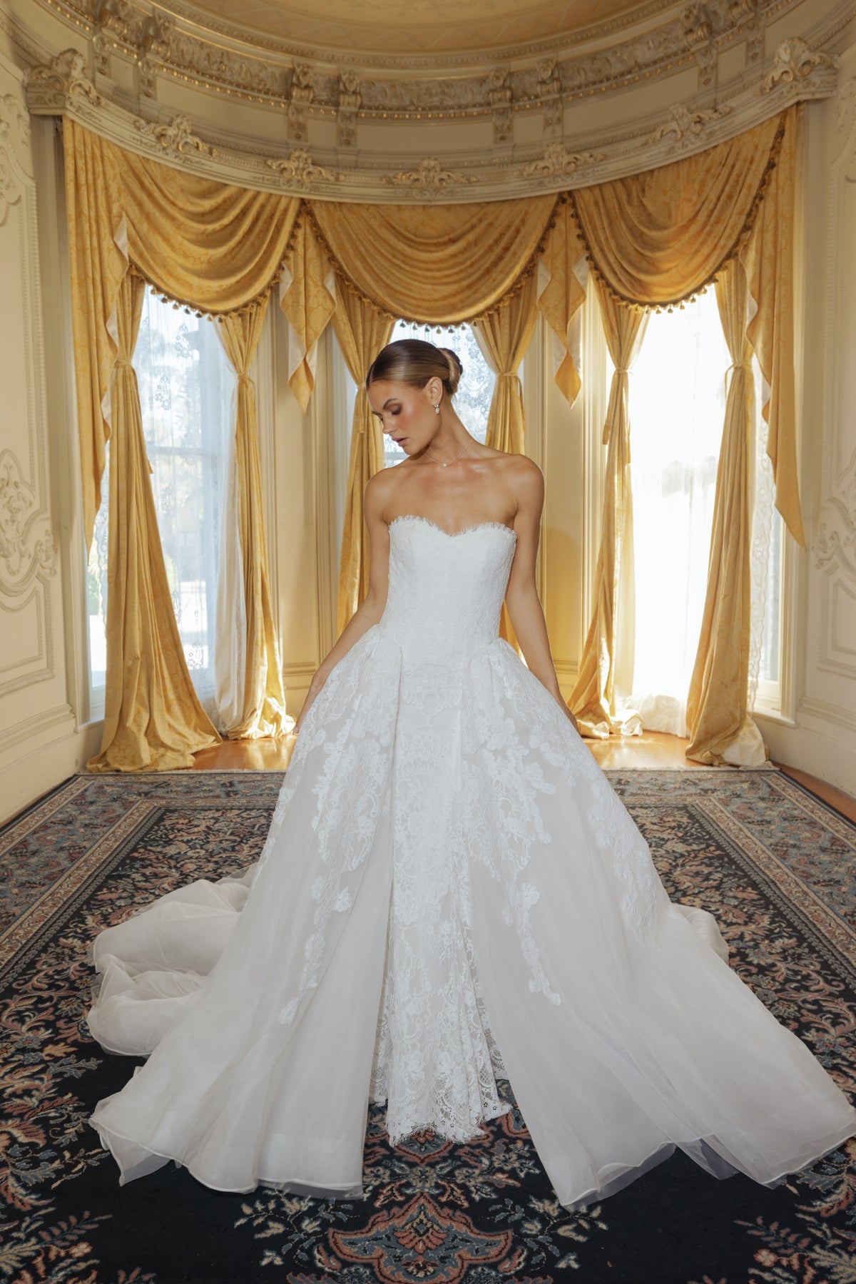 fitted lace wedding gown with sweetheart neckline and scalloped train 