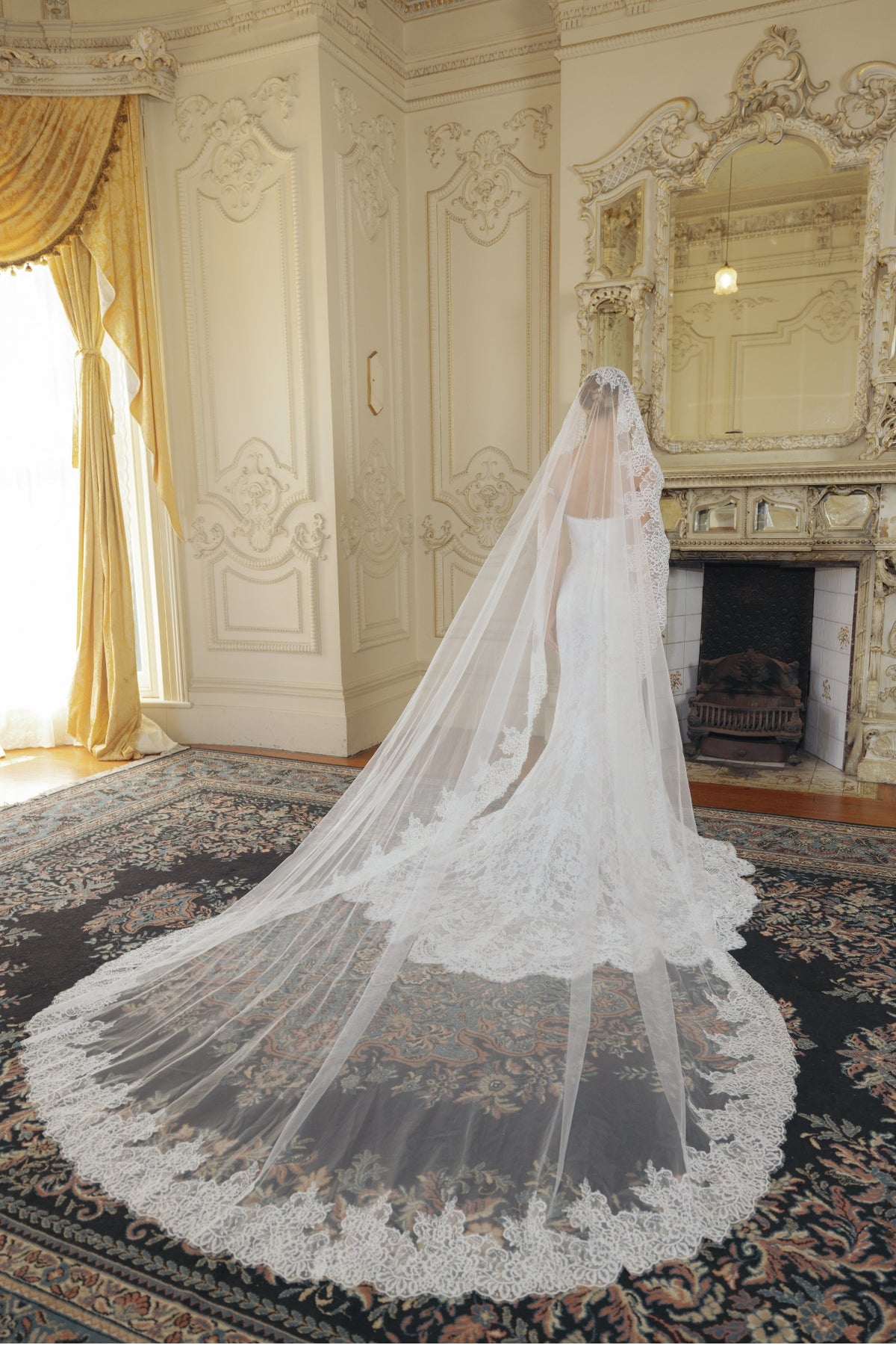 fitted lace wedding gown with sweetheart neckline and scalloped train 