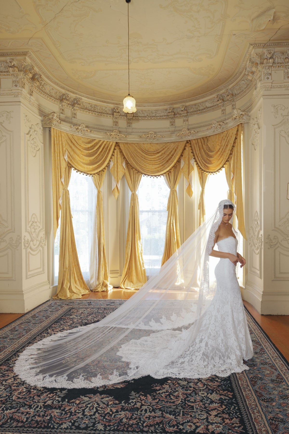 fitted lace wedding gown with sweetheart neckline and scalloped train 