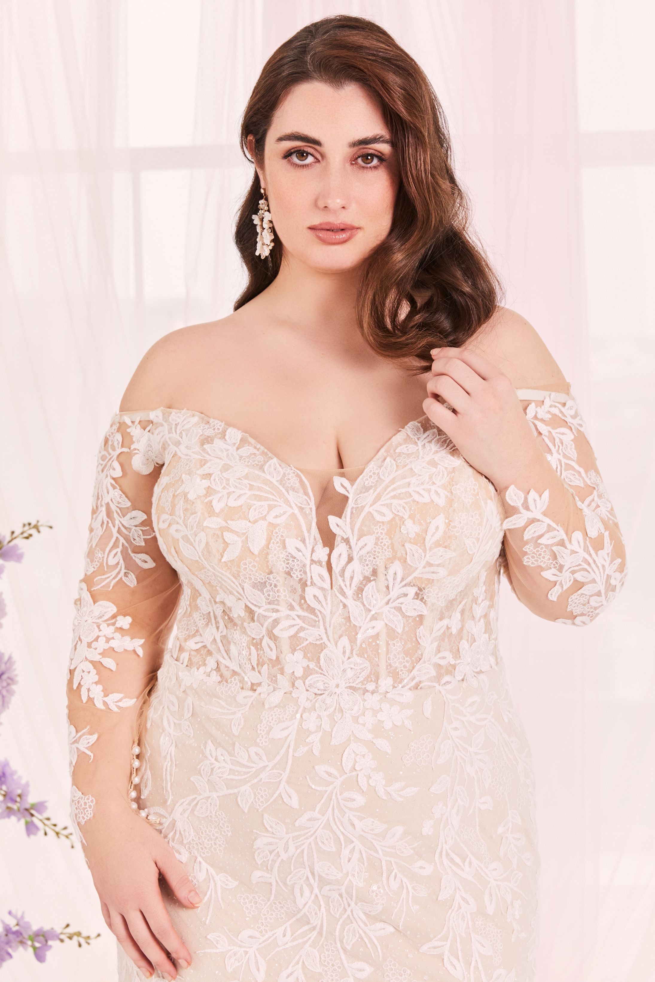 Lace long sleeve plunging neckline wedding dress.
