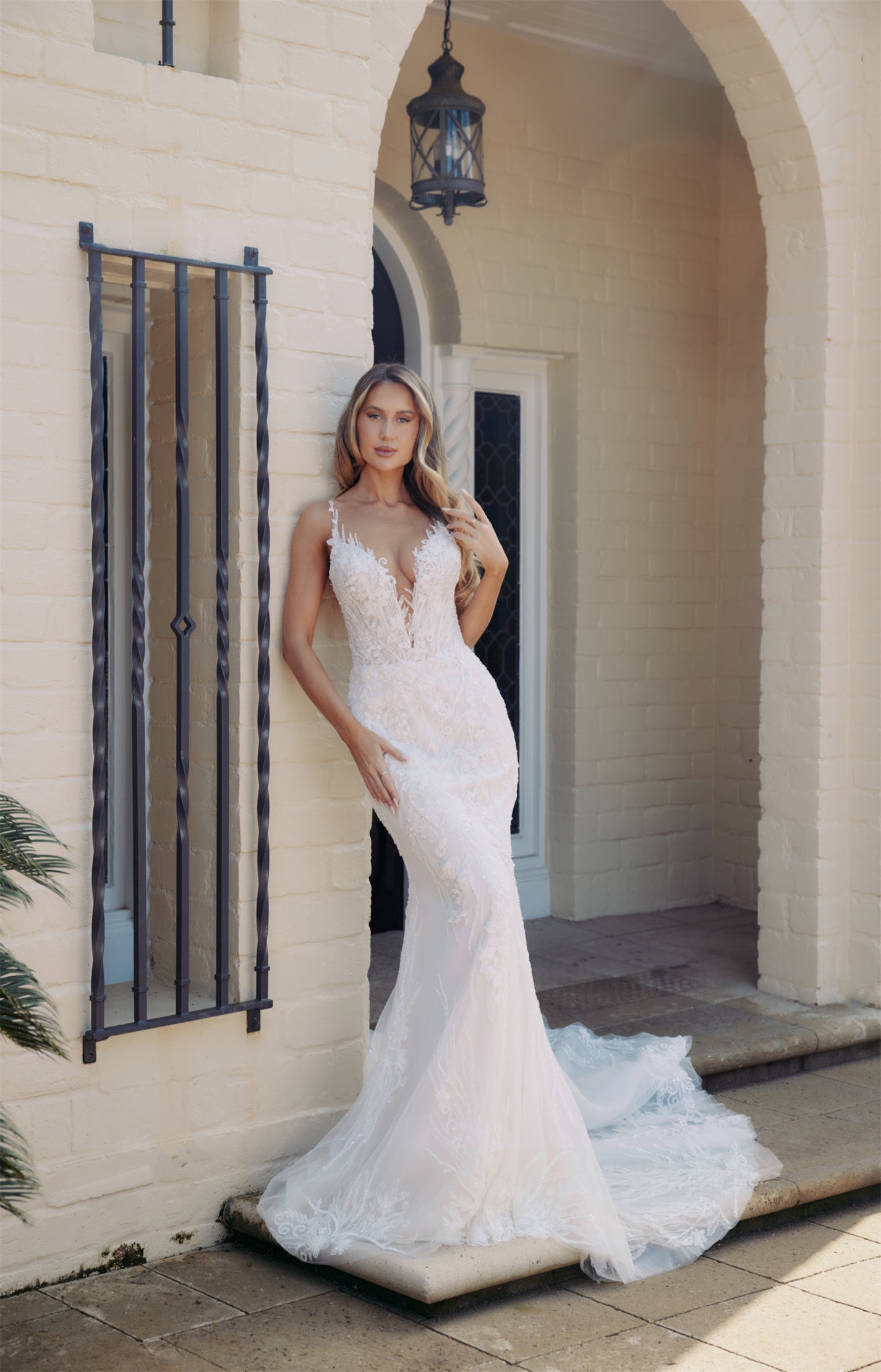 DAPHNE Bridal Gown - Wedding dress by Victoria Collection Jessica Couture. Featuring a Fit-N-Flare Beaded lace gown with chapel train, and V-plunge neckline 