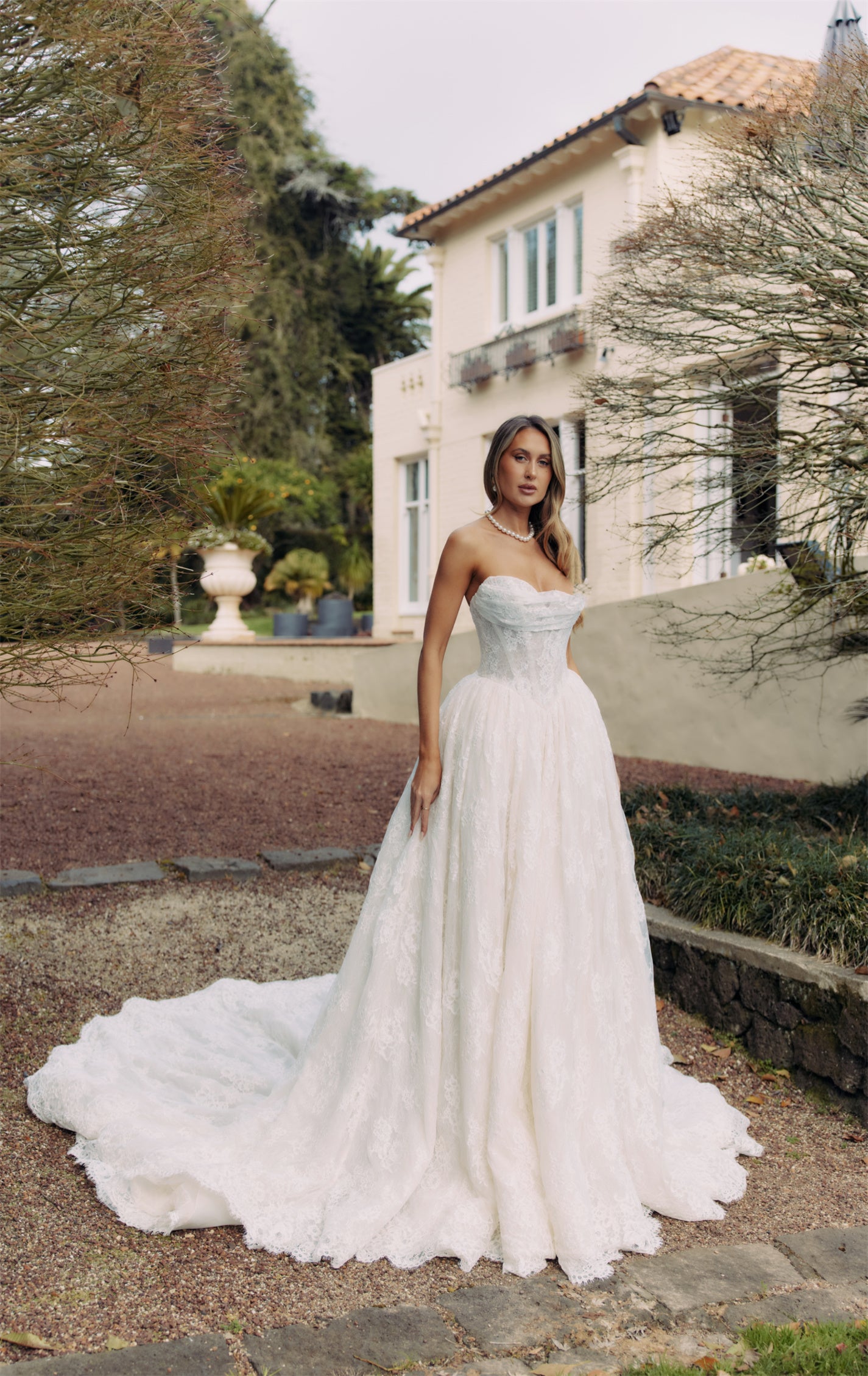 ELEANOR Bridal Gown - Wedding dress by Victoria Collection Jessica Couture. Featuring an A-line Princess ballgown with chapel train, and ruched corset Bodice with Chantilly lace. 