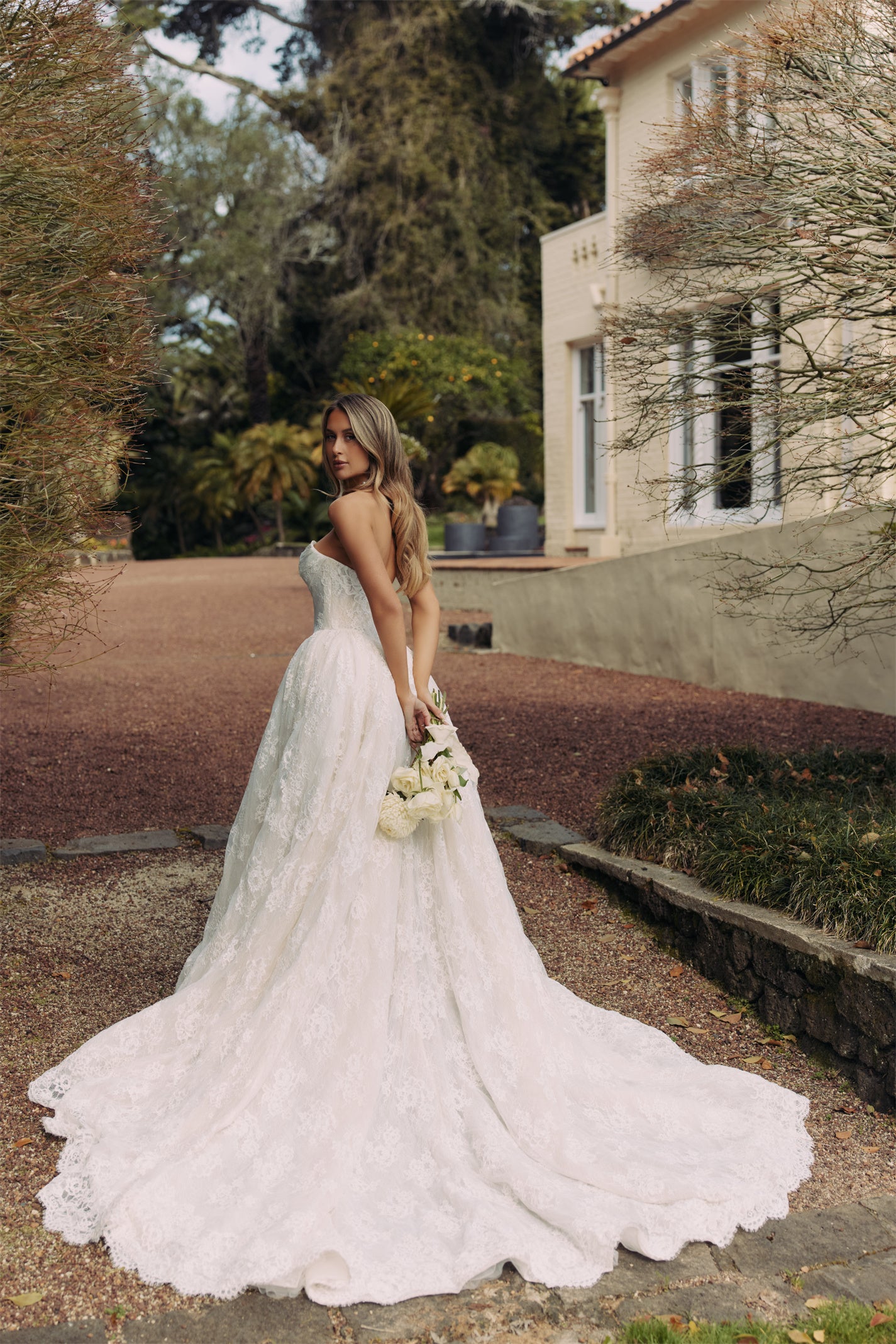 ELEANOR Bridal Gown - Wedding dress by Victoria Collection Jessica Couture. Featuring an A-line Princess ballgown with chapel train, and ruched corset Bodice with Chantilly lace. 