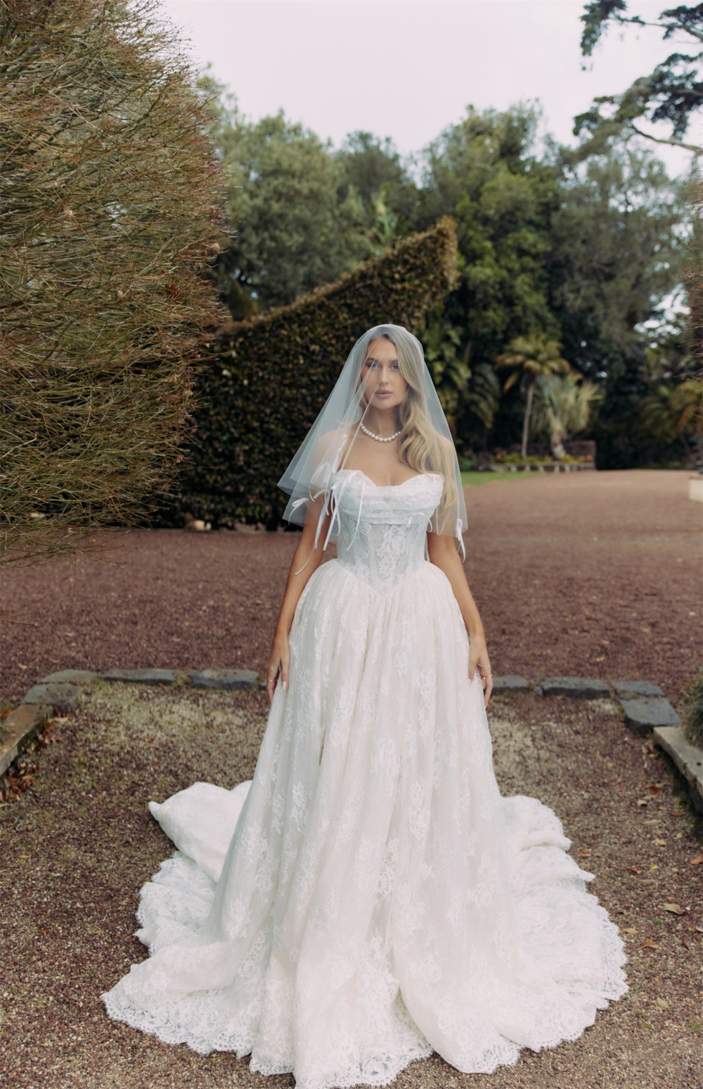ELEANOR Bridal Gown - Wedding dress by Victoria Collection Jessica Couture. Featuring an A-line Princess ballgown with chapel train, and ruched corset Bodice with Chantilly lace. 