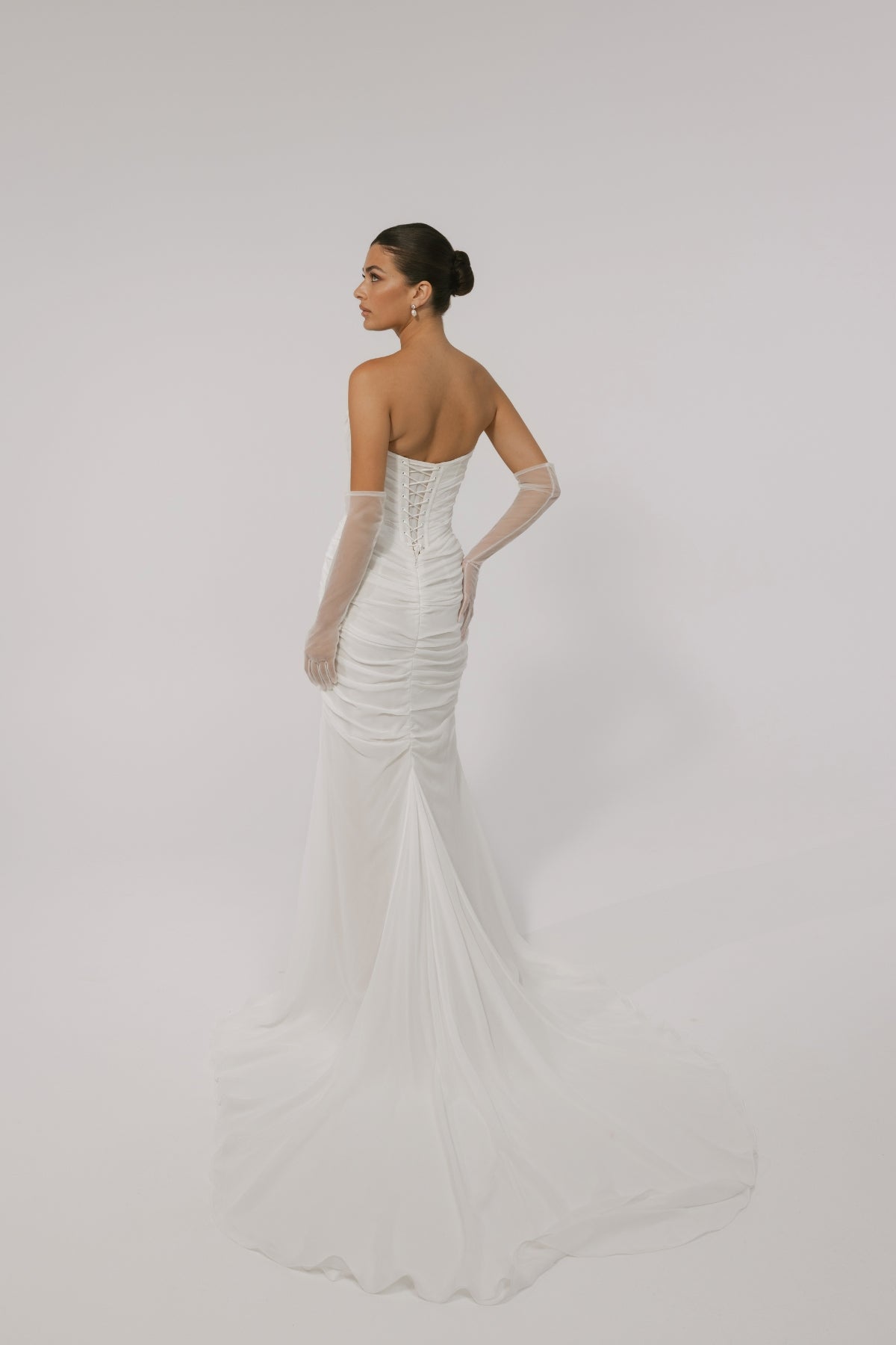 Corseted chiffon wedding gown, fitted lace-up back style. 