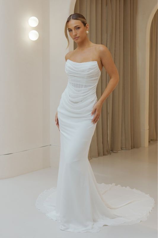 Fitted Bridal gown in draped chiffon, featuring cat-eye neckline