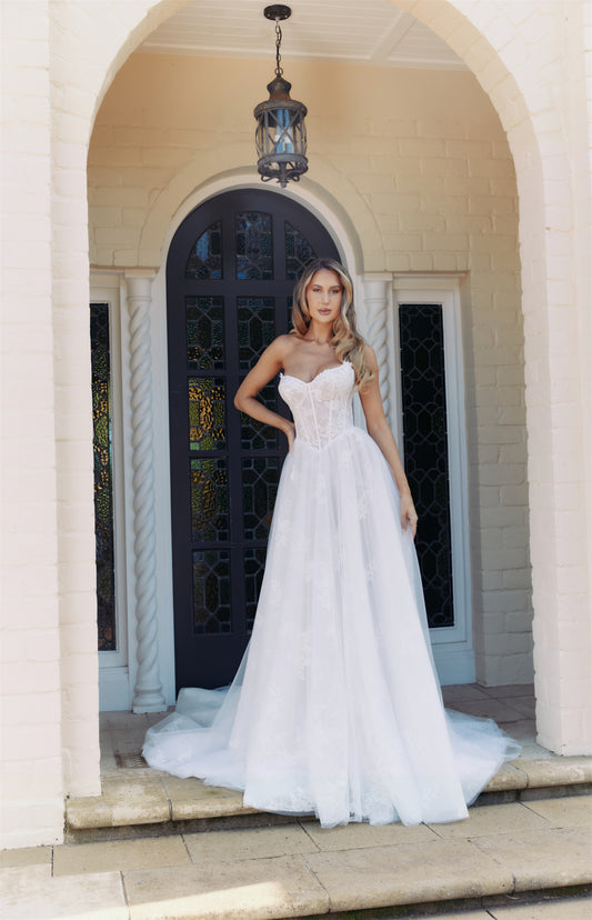 FAYE Bridal gown - By Victoria Collection Jessica Couture, featuring an A-line gown with Cat-eye bodice covered in delicate lace
