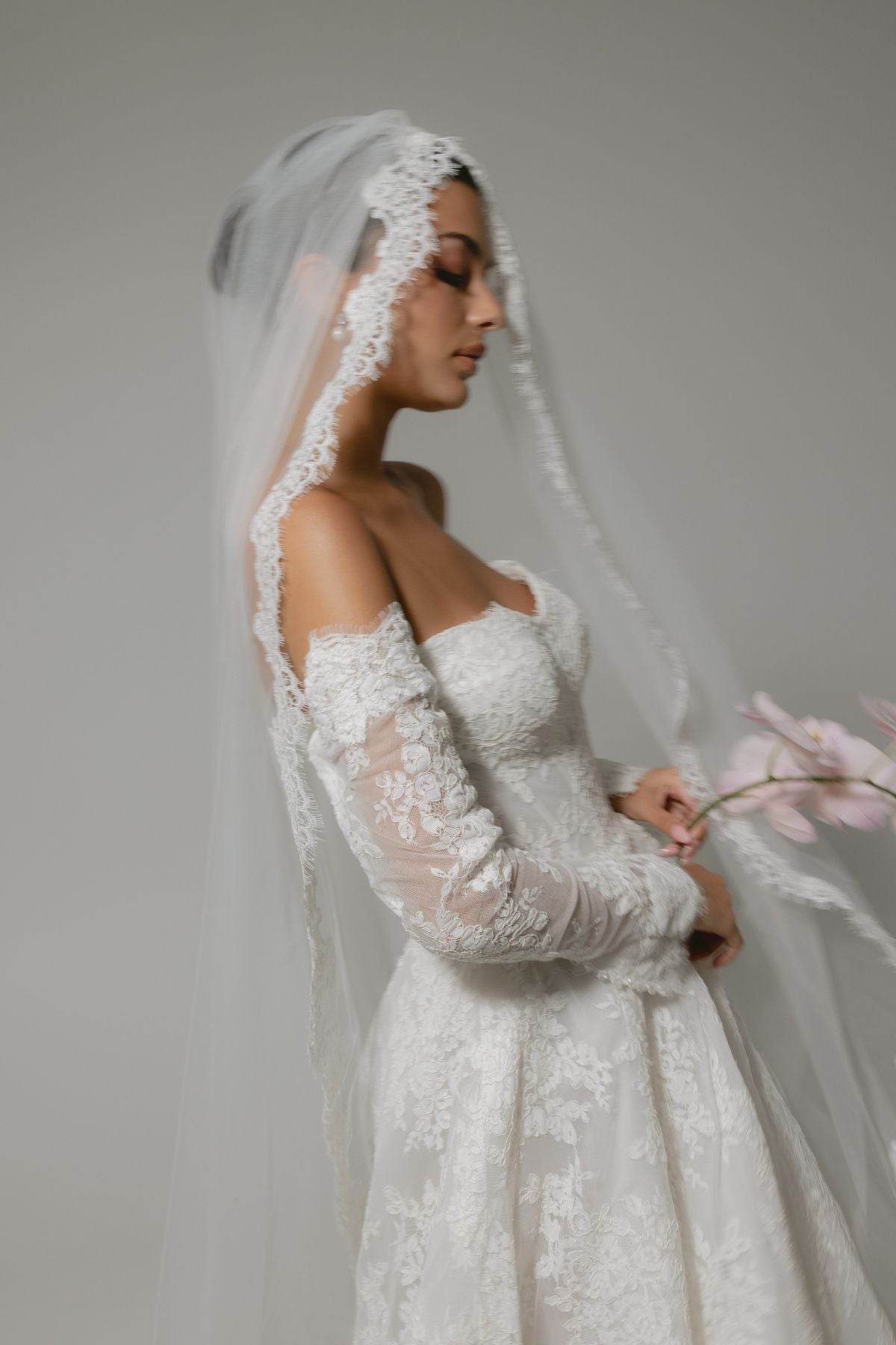 Lace A-line wedding gown with off the shoulder sleeves, dramatic chapel train 