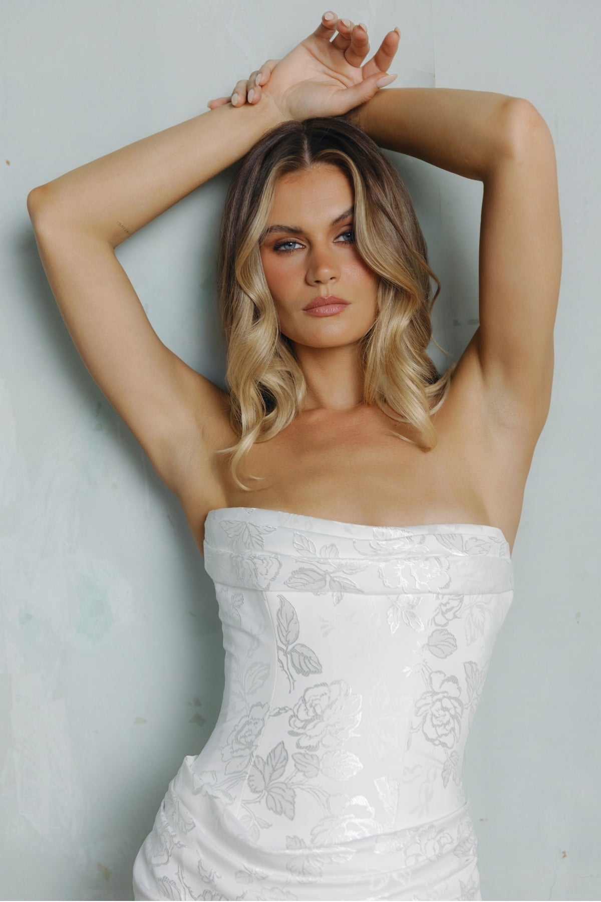 Fit n flare wedding gown in floral jacquard fabric, strapless neckline and ruching around bust and hips. 