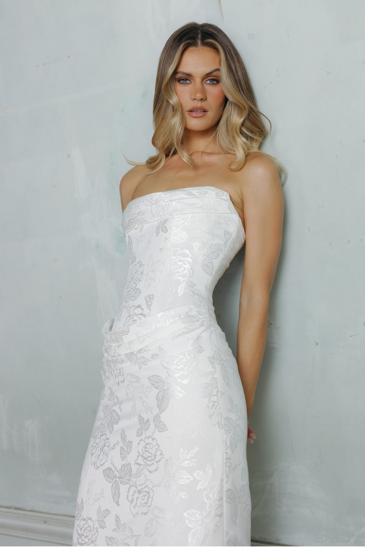 Fit n flare wedding gown in floral jacquard fabric, strapless neckline and ruching around bust and hips. 