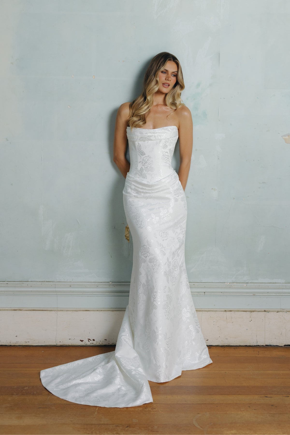 Fit n flare wedding gown in floral jacquard fabric, strapless neckline and ruching around bust and hips. 