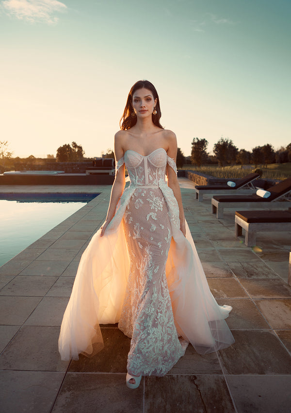 Model wears Jamina overskirt which is made from soft tulle and glows in the twilight. 