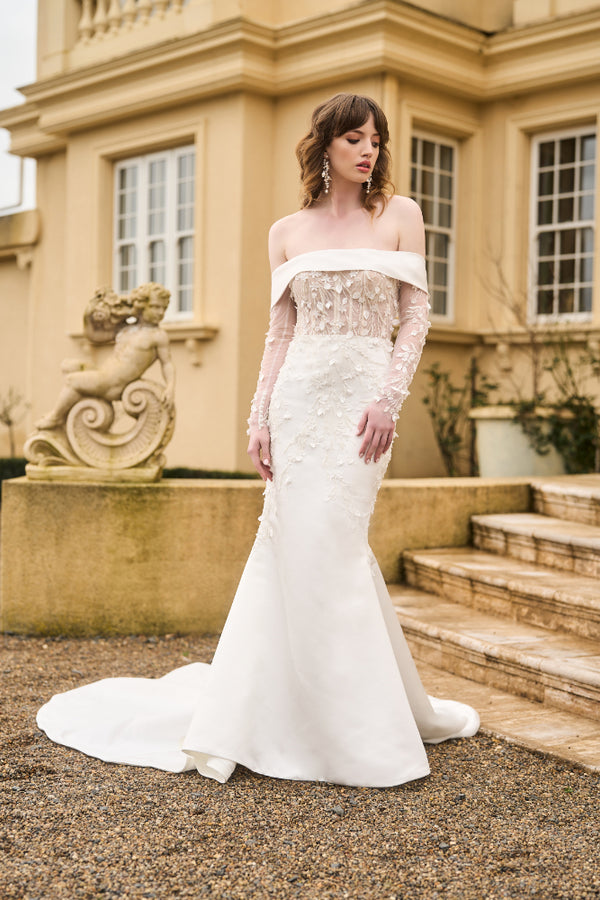Theia gown with detachable fitted sleeves made from signature JC lace.