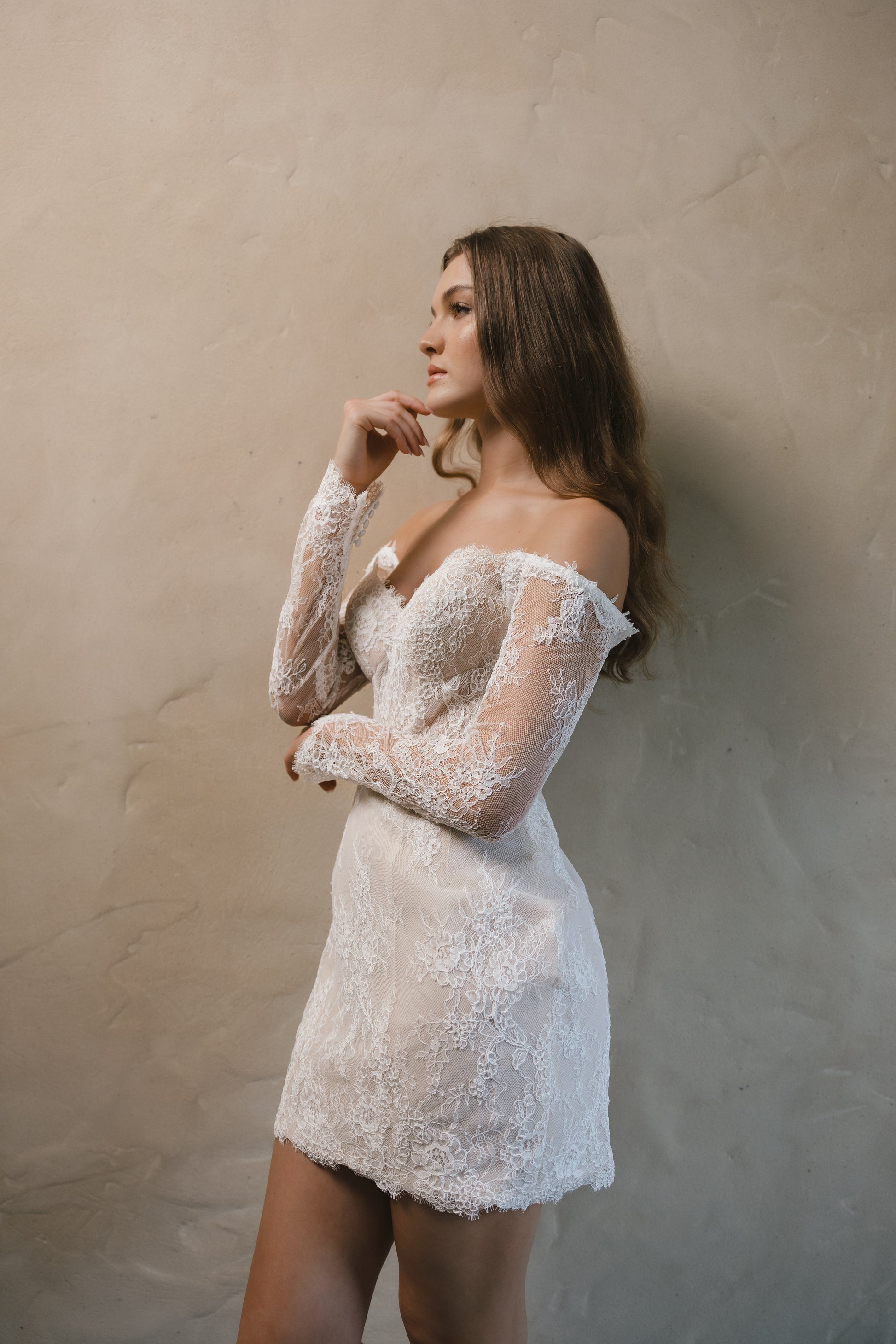 Bridal gown Lillian is a vintage-inspired mini with delicate lace, perfect for champagne celebrations late into the night. By Roselle Collection Jessica Couture.