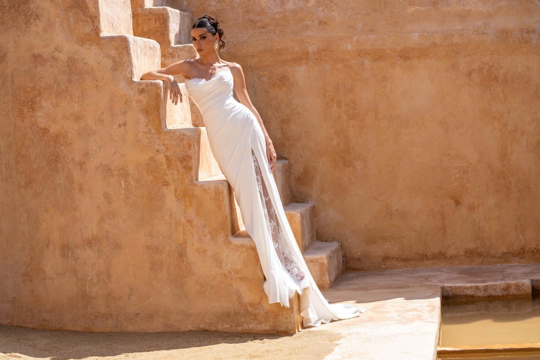 Fitted wedding dress, in plain crepe with lace covering the split. sweetheart neckline, complete with detachable fitted lace sleeves 